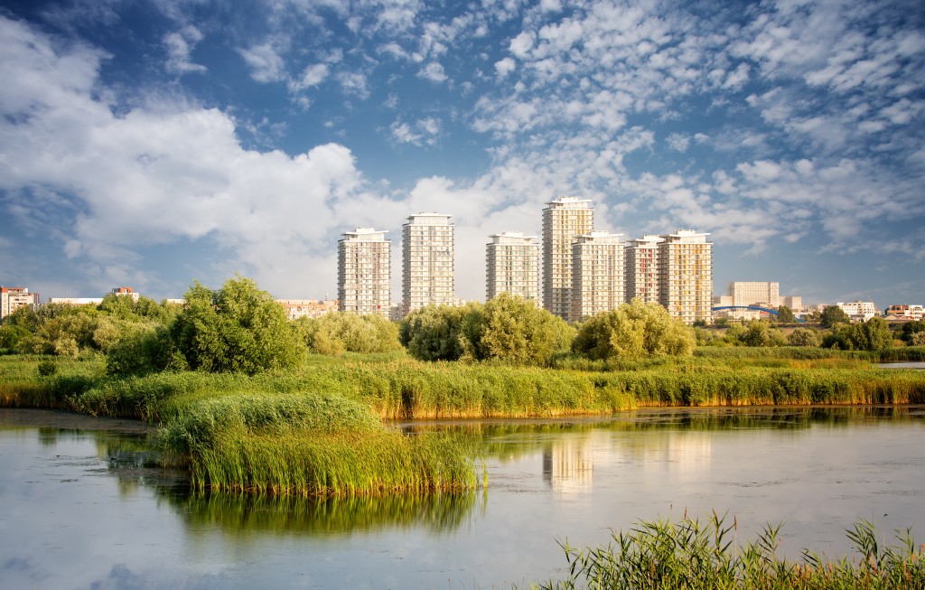 Vacaresti Nature Park - Delta between the blocks with skyscrapers in the background, in Bucharest, Romania. (Credit dpvue studio/Shutterstock)